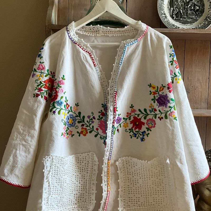 Embroidered upcycled jacket with crochet pockets